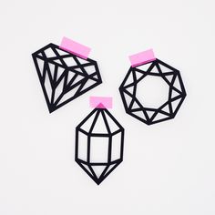 three pieces of paper cut out to look like diamonds