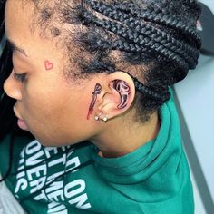 a woman with a tattoo on her ear