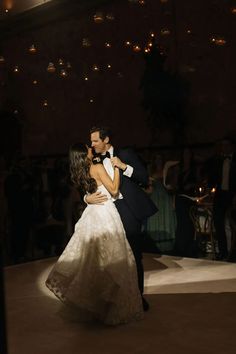 a bride and groom sharing their first dance