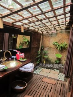 a bathroom with a wooden floor and walls