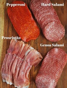 four different types of salami on a cutting board with the names in italian and english