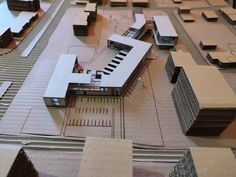 an architectural model of a building surrounded by buildings