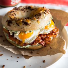 a bagel sandwich with an egg on top