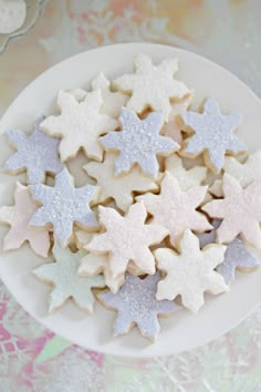 some white and silver stars on a plate