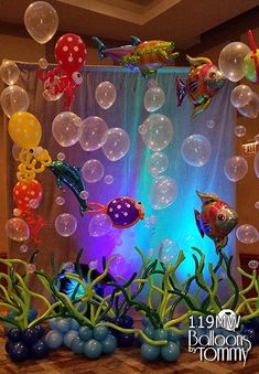 an aquarium themed birthday party with balloons and fish