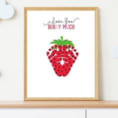 a framed poster with a strawberry on it