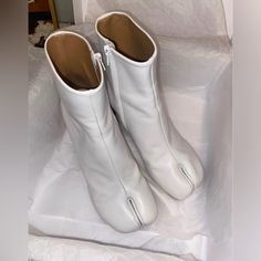 Authentic Maison Margiela Tabi White Ankle Boots Fitted With A Curved Heel And Zipper Sides. Made With Leather Upper And Leather Soles. Authentic Comes With The Original Box And Dust Bags. These Are A Bright White Color. Size 36 Or Women’s Us 6. This Listing Is Cross Posted! Any Questions Comment Below Thank You. Maison Margiela Tabi Boots, Margiela Tabi Boots, Maison Martin Margiela Shoes, Tabi Boots, White Ankle Boots, Maison Margiela Tabi, Margiela Tabi, Margiela Shoes, Bright White