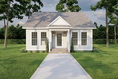 a small white house sitting on top of a lush green field