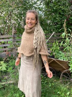 Warm, cozy poncho with turtleneck made of soft alpaca wool, lovingly hand-knitted Cozy Knitted Alpaca Poncho, Hand-knitted Beige Poncho For Winter, Hand Knitted Beige Poncho For Winter, Hand Knitted Beige Poncho For Fall, Cozy Hand Knitted One Size Poncho, Faery Queen, Cowl Neck Poncho, Farm Girl, Alpaca Wool