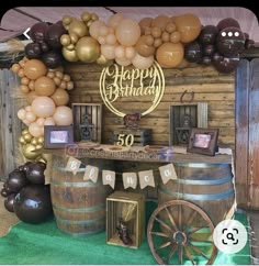 a birthday party with balloons and decorations on the wall, including an old fashioned wagon