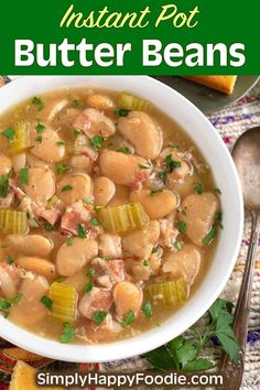 a bowl of instant pot butter beans with carrots and parsley in the background