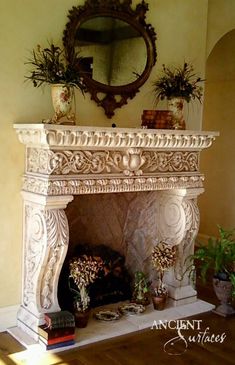 an ornate fireplace with potted plants on the mantle