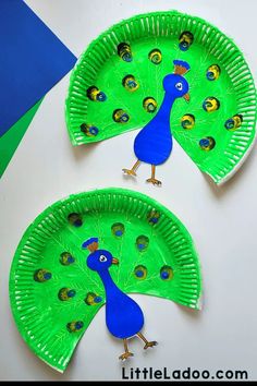 two paper plates with peacocks on them