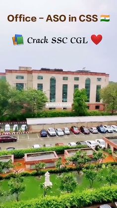 an office building with cars parked in the parking lot