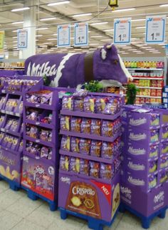 the purple cow is on display in the grocery store's produce section, and it appears to be for sale