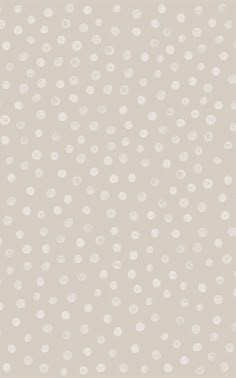 a white polka dot pattern on a beige background