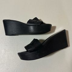 Vintage Tory Burch Lowell/Patti Style Black Wedge Leather Sandals Size 8. Since These Are A Retired Style I Couldn’t Find The Exact Name! High Quality, Y2k Style Wedges With Genuine Leather Insoles And Straps That Will Pair Well With Any Outfit! In Good Condition With No Major Flaws; However They Do Show Signs Of Wear As Shown In Photos And Listed Below: Scuffing On Tips And Heels Of Leather Insoles Scuffing On The Leather Straps Scuffing On The Wooden Wedges (Sides) Wear On Bottom Rubber Soles, Especially In The Heel Areas Debris Inside The Little Holes Of The Leather Straps Wear To The Inner Leather Soles (Including Flattening Of The Tory Burch Logo Embossed On Wooden Wedges, Black Wedge, Leather Wedge Sandals, Tory Burch Shoes, Vintage Shoes, Y2k Style, Women's Shoes Sandals, Leather Sandals, Tory Burch