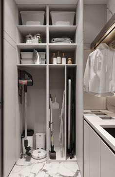 an organized kitchen with white cabinets and marble flooring is pictured in this image, there are many items on the shelves