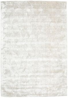 a white rug with an abstract design on it