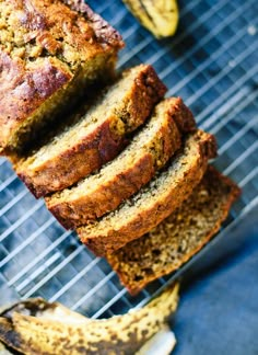 sliced banana bread sitting on top of a cooling rack