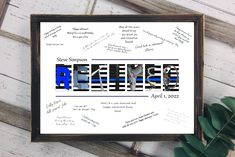 a framed poster with the words retrieving in blue and black on it next to a plant