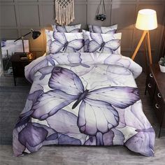 a bed with purple butterflies on it