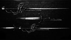 two swords with chains attached to them against a brick wall