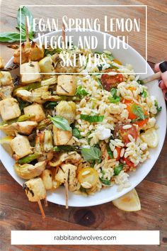 vegan spring lemon veggie and tofu skewers on a white plate