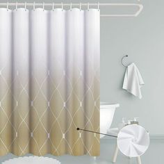 a bathroom with a shower curtain, toilet and bathtub in white and beige tones