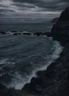 the ocean is very dark and stormy at night