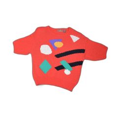 a red sweater with colorful shapes on it