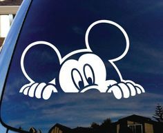 a mickey mouse sticker on the side of a car