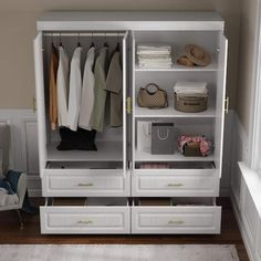 a white closet filled with lots of clothes