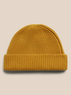 Inspired by fisherman's hats from the turn of the century, this luxuriously soft and warm cashmere beanie is designed in a shorter length so it sits higher up.  Ribbed knit design adds softness and a luxe texture.  Length: 9. 25" (23. 5cm) Classic Solid Beanie For Fall, Classic Soft Knit Hat For Everyday, Ribbed Wool Hat For Fall, Fall Ribbed Wool Hat, Classic Solid Color Fall Beanie, Classic Soft Knit Beanie, Classic Knitted Beanie For Everyday, Classic Knitted Everyday Beanie, Classic Beanie Hats For Fall