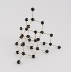 the model is made up of several black and white balls, each connected to one another