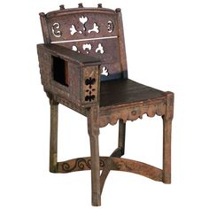 an old wooden chair with a dog design on the front and back seat, made out of wood