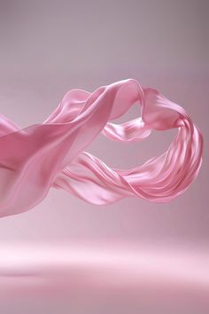 a pink silk fabric blowing in the wind