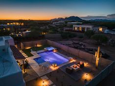 an aerial view of a pool at night