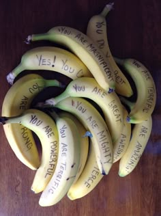 a bunch of bananas with writing on them