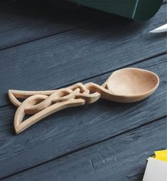 a wooden spoon sitting on top of a table