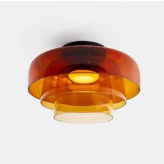 an orange and brown light hanging from the ceiling