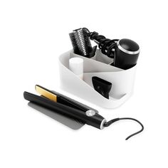 a hairdryer, brush and comb holder on a white background with clippings