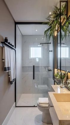 a bathroom with two sinks and a toilet in the middle, along with a shower stall