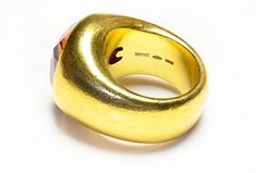 Natan Gold Citrine Ring This eye-catching ring features a bold, wide setting of 18K yellow gold, creating a dramatic backdrop for the centerpiece: a large, radiant citrine by Natan. Known for its deep golden color that echoes the warmth of sunlight, the citrine is prominently displayed, making this ring a standout choice for those who favor bold and striking jewelry pieces. Ring is currently size 7. Signed Natan 750. ANTIQUE AND VINTAGE RINGS Belperron Jewelry, Costume Jewelry Earrings, Belt Purse, Citrine Ring, Georg Jensen, Silver Enamel, Golden Color, Jewelry Rings Engagement, Ring Bracelet