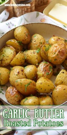 garlic butter roasted potatoes in a white bowl on a floral cloth with text overlay