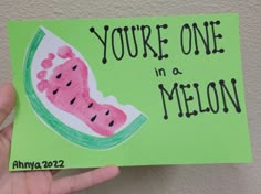 someone holding up a piece of paper that says, you're one in a melon