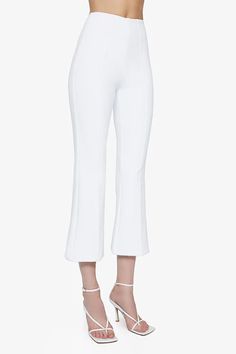 An immediate best-seller, our crop flare pant is beloved for its ultra-flattering fit. Compression fabric acts as shapewear, slimming and smoothing as the front pintuck detail elongates your shape. The material we selected utilizes the same technology as high-performance workout wear – it’s breathable, sweat-wicking, quick-dry, and wrinkle-free – but you’d never know that just by looking at it. Kick Flare Pants, Cropped Flare Pants, Crop Flare, Flare Pant, Compression Fabric, Kick Flares