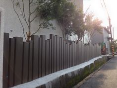 a fence is shown next to a building