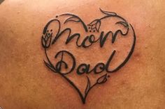 a woman's back with the word mom dad written on it in a heart shape