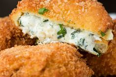 closeup of bread with cheese and spinach on it